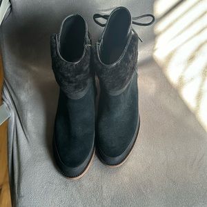 Black short UGG boots with side zipper and fur. Excellent condition barely worn!